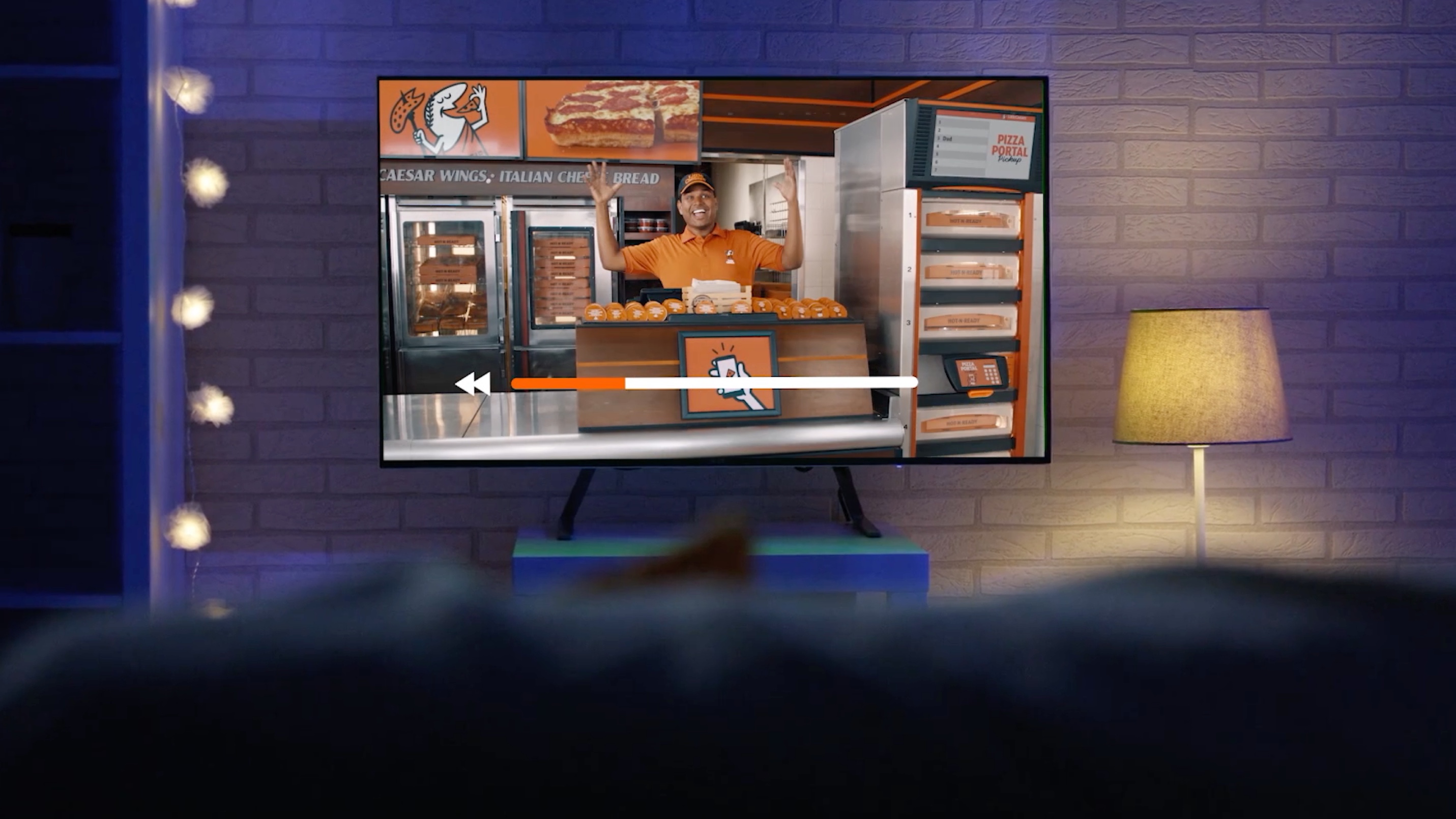 Little Caesars commercial paused on TV.